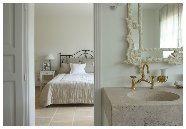 In-room bathroom with vintage clawed bathtub.